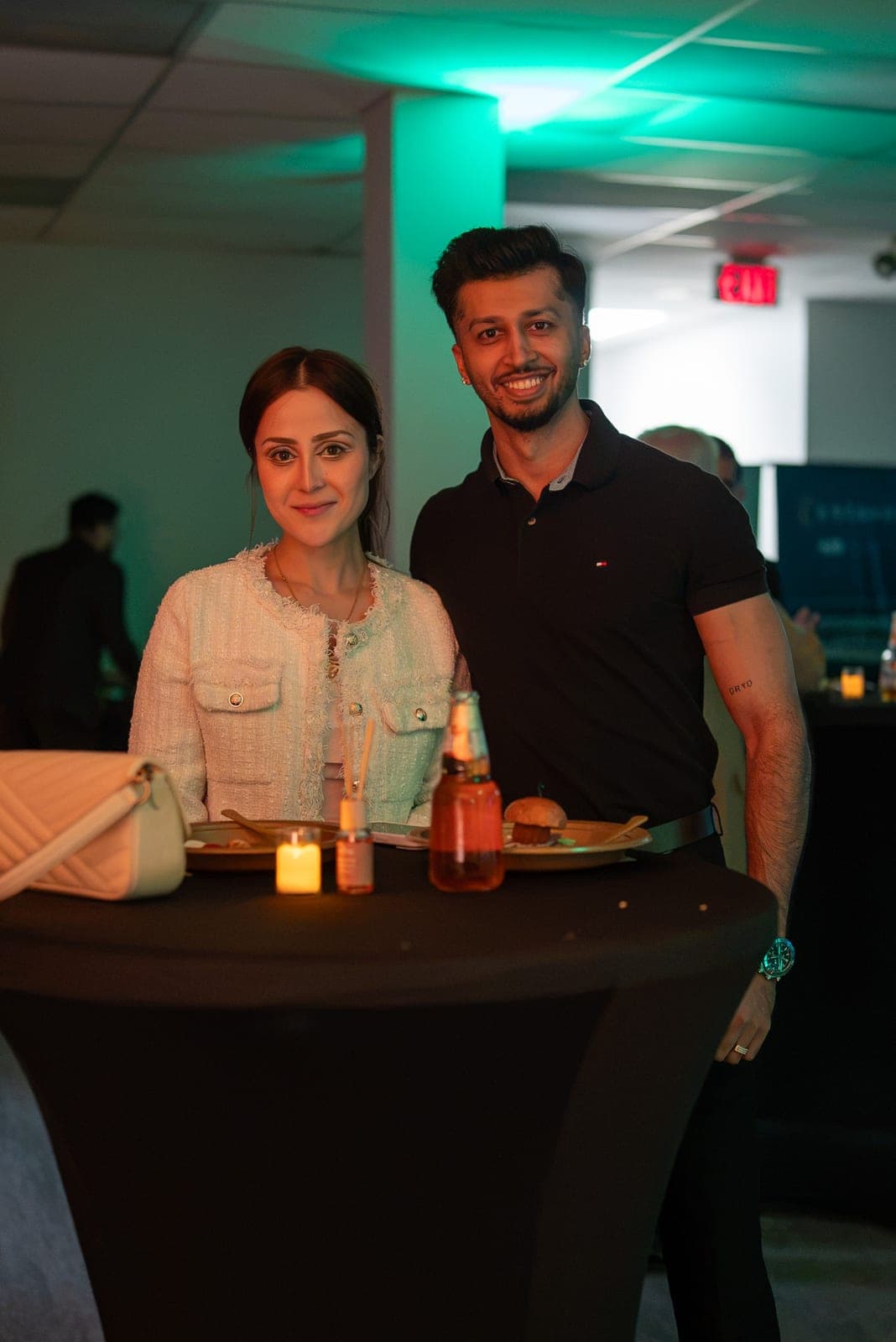 Two guests smiling at an Estavio team evening